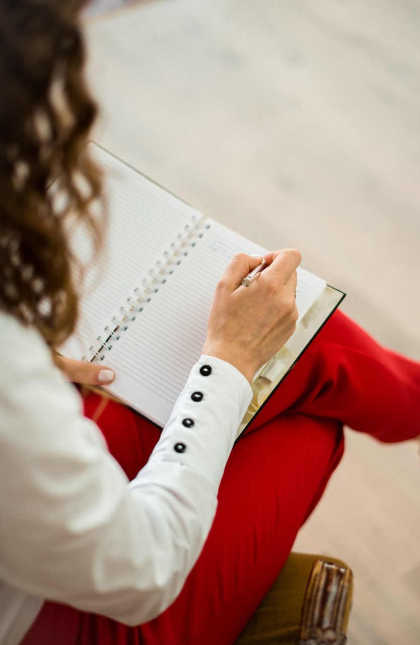 Woman writing in a notebook
