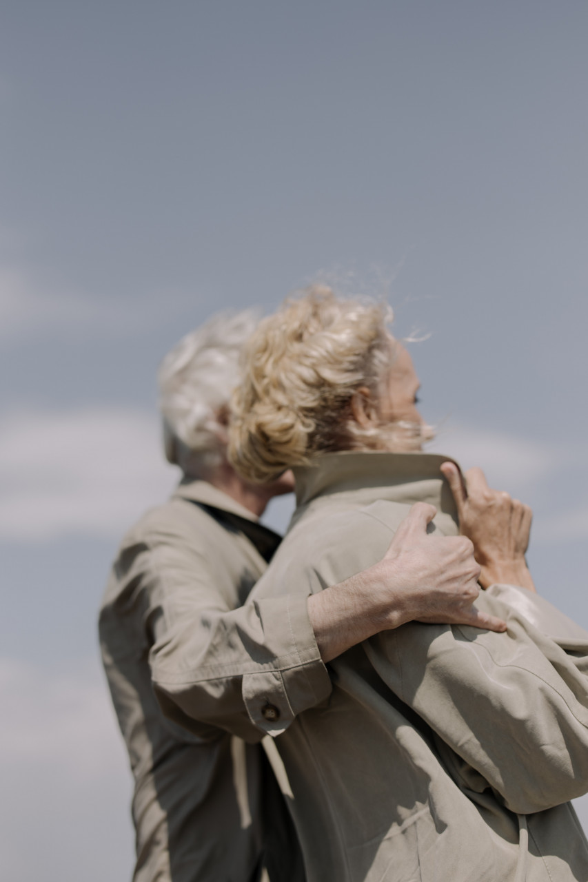A husband holding his wife