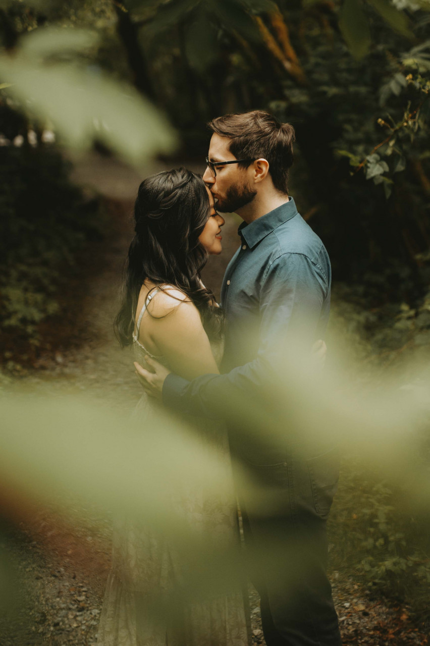 A man kissing his wife