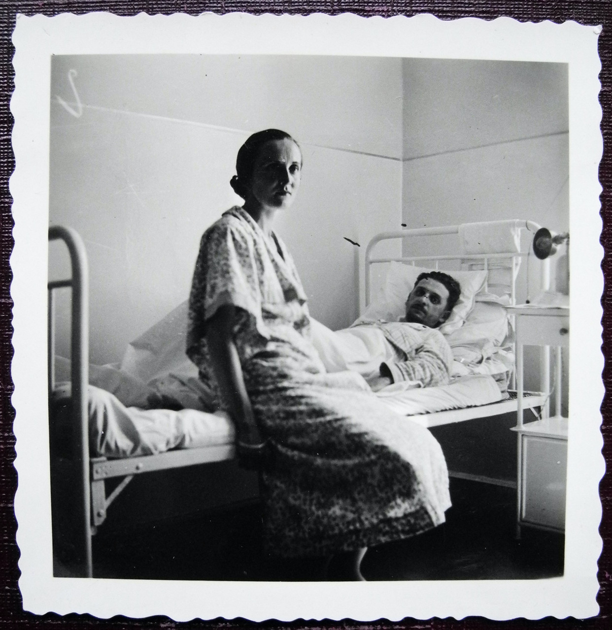 A wife visiting her husband in the hospital.