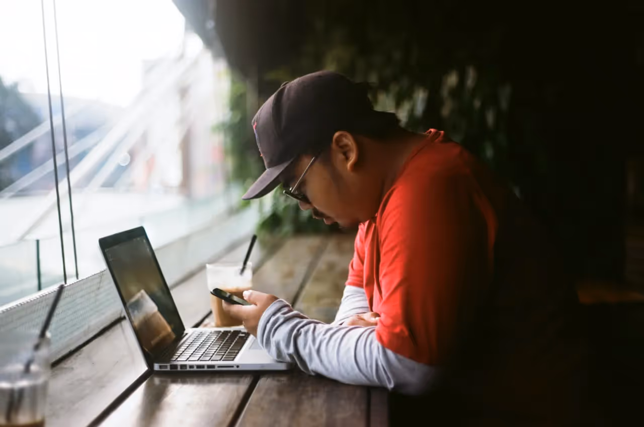 An employee looking at his phone while at work.