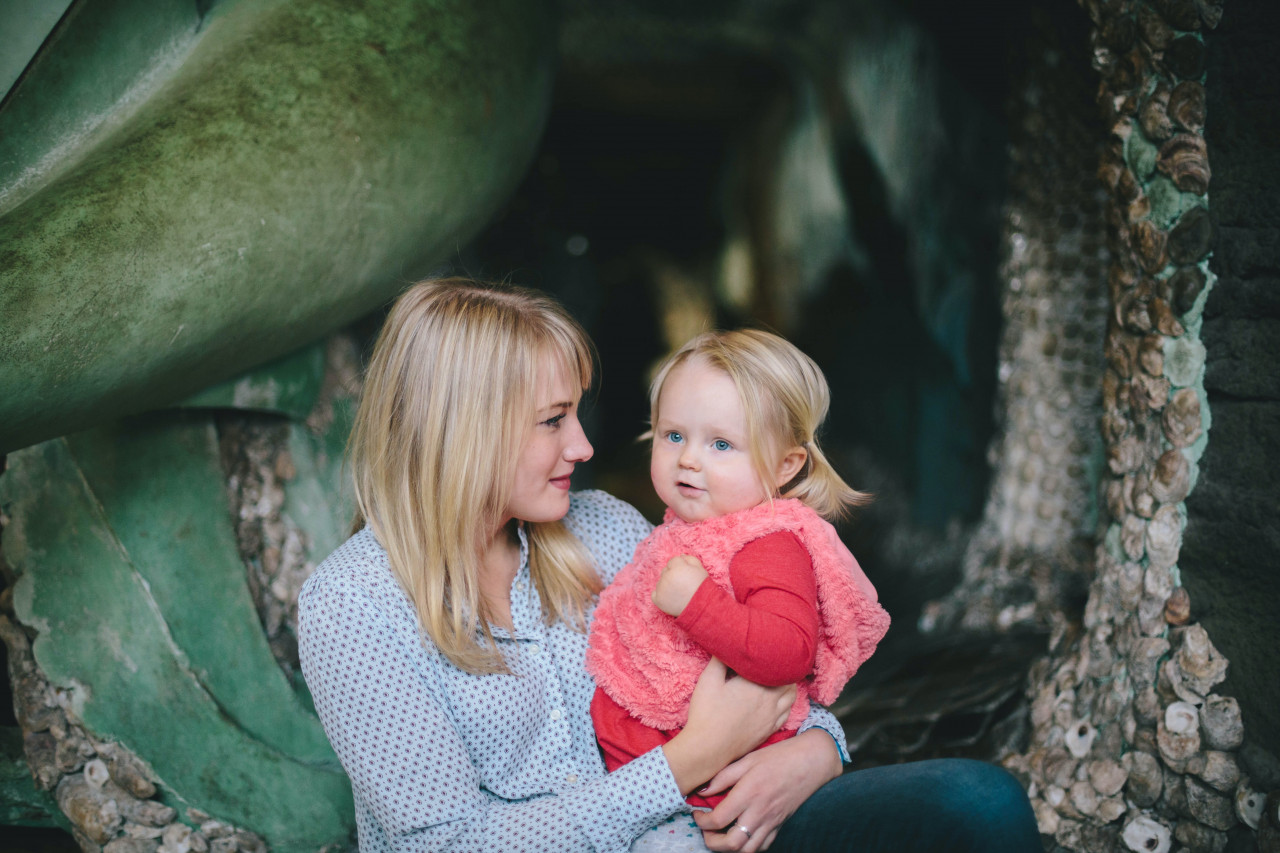 A doting mother holding her daughter.