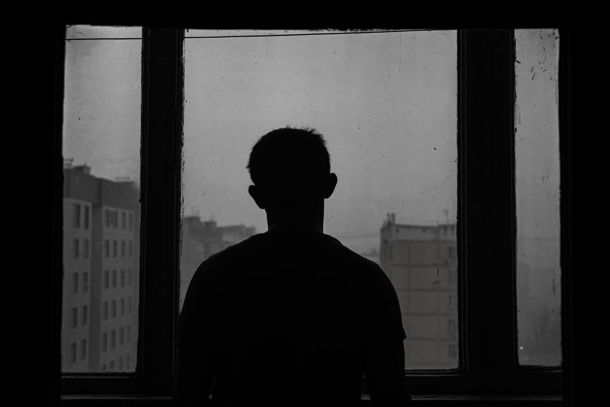 a person looking out the window