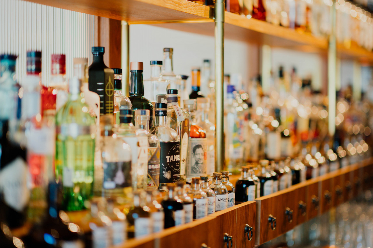 A cross-section of alcohol on shelves.