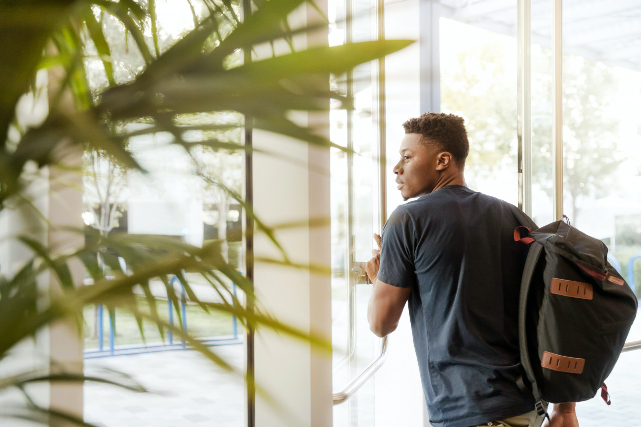 A teen student leaving the school.