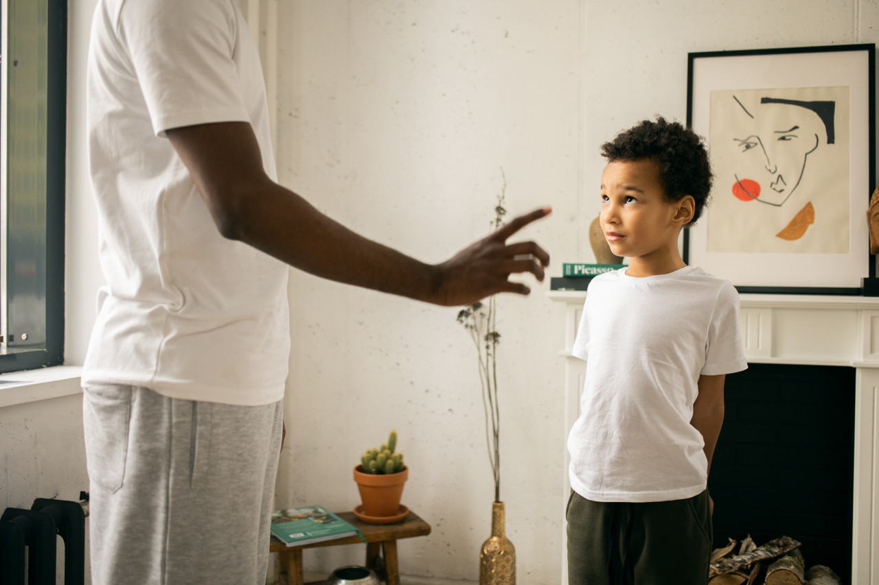 A man talking to his son.