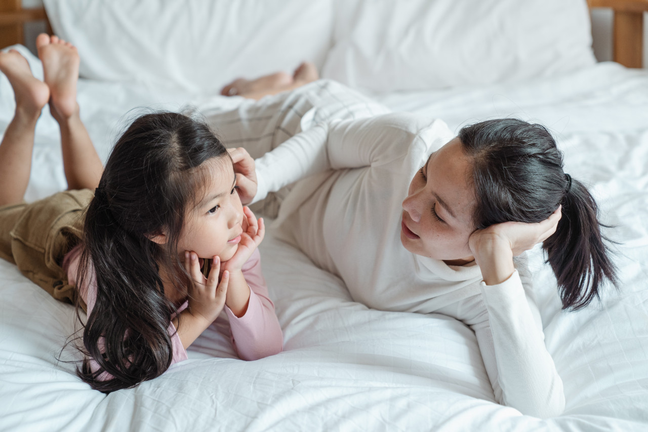 A mother talking to her daughter.