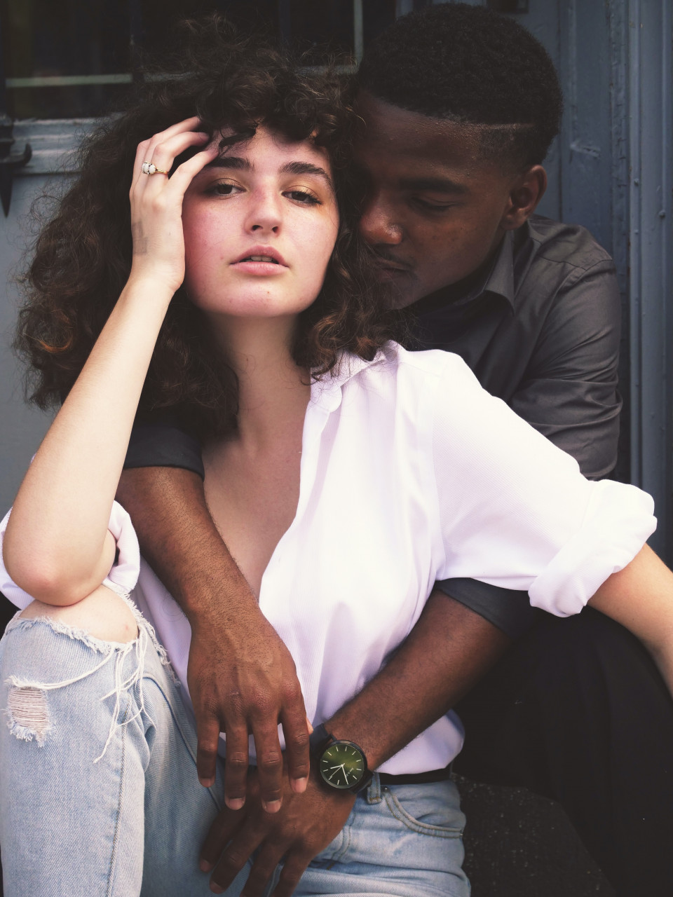 A man holding his wife close.