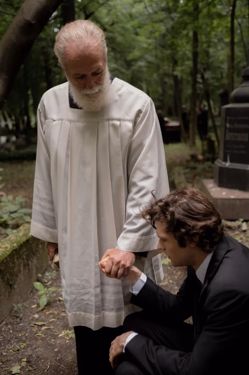 A priest holding a man