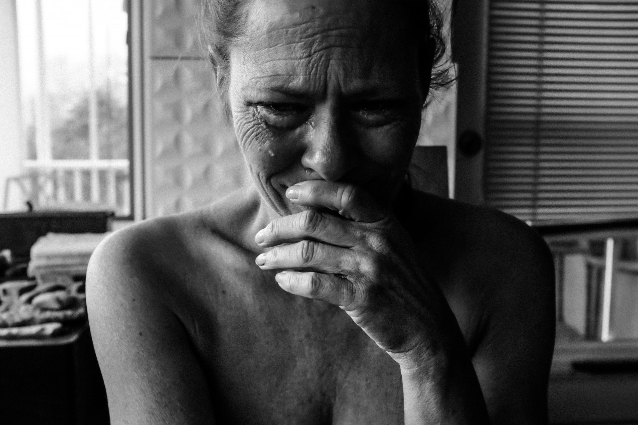 A mother crying profusely.