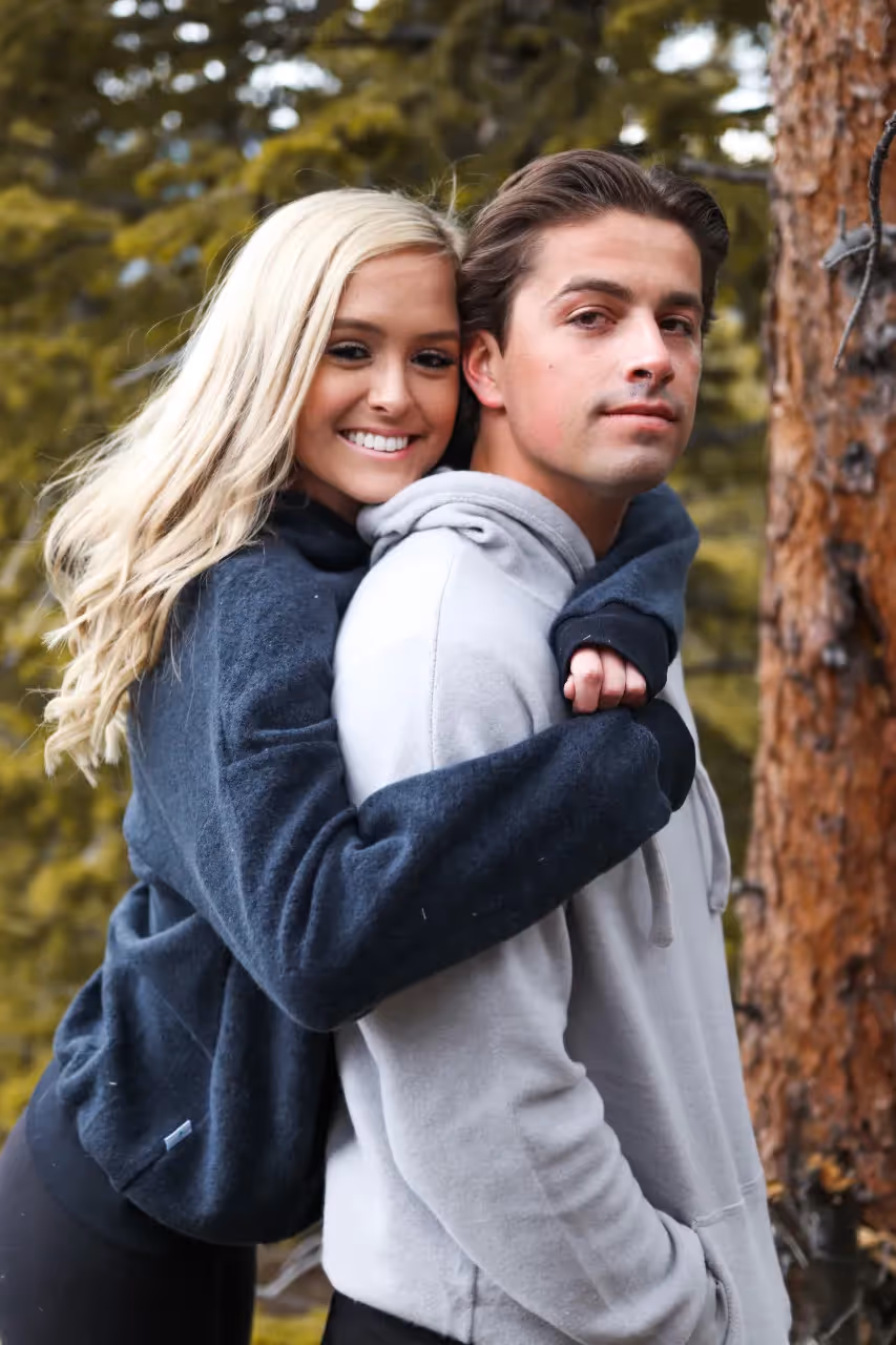 A teen embracing her boyfriend.