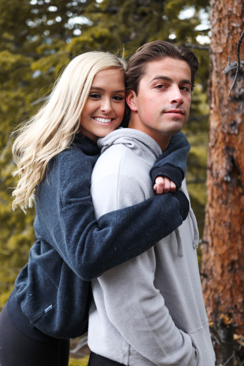 A teen embracing her boyfriend.