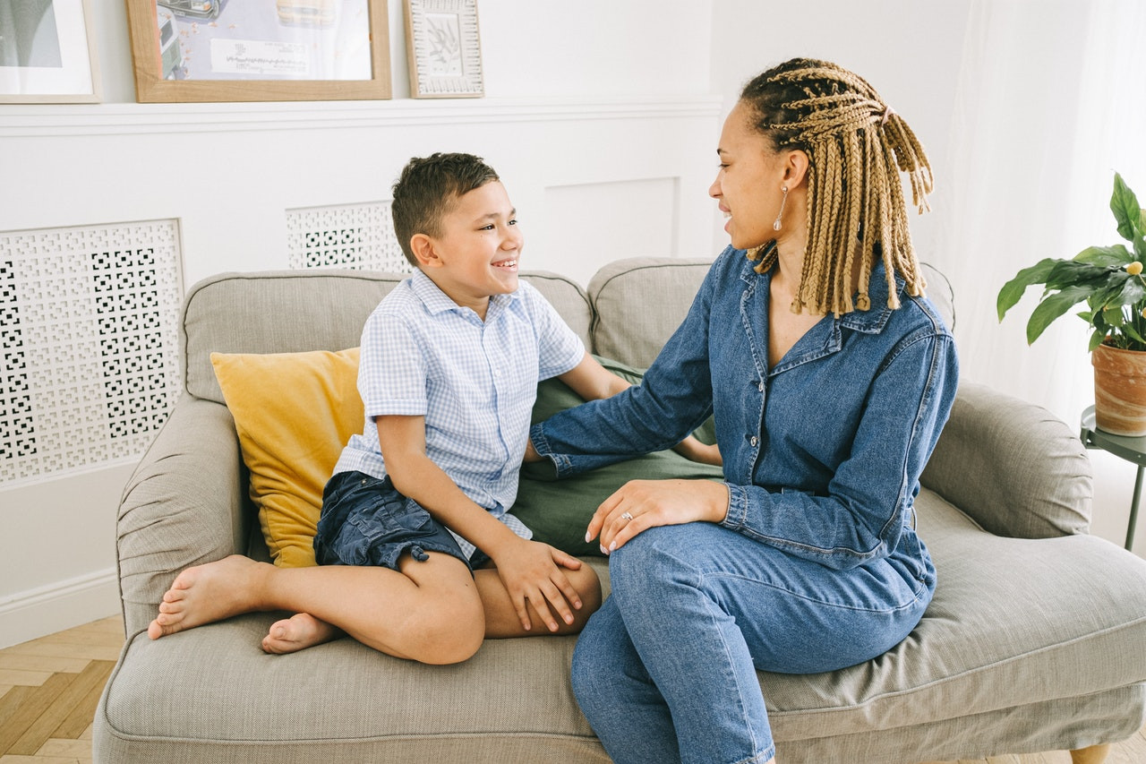 Mom and son talking on couch