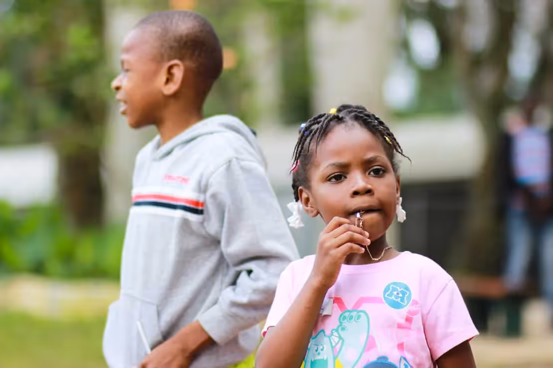 a brother and sister together outside