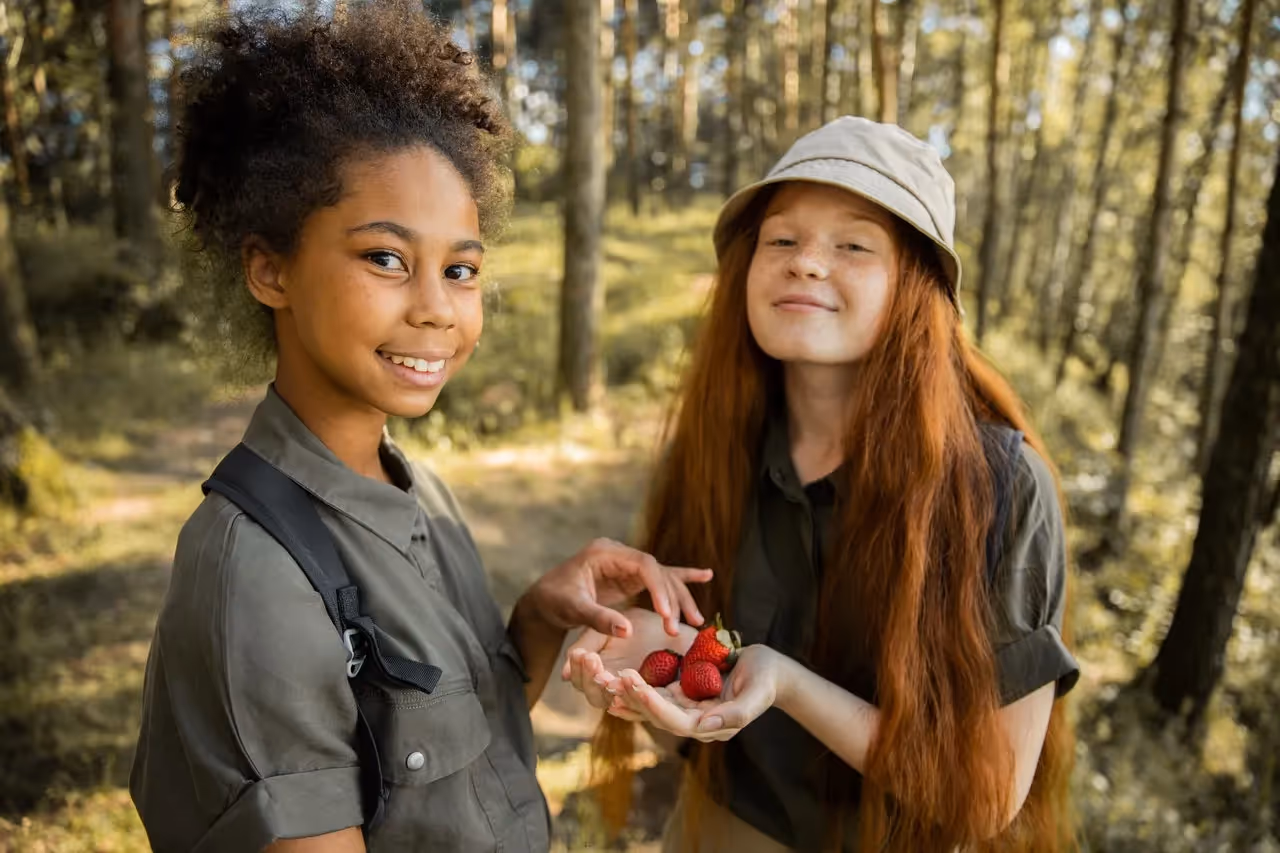 Scout Girls with Strawberries in Forest