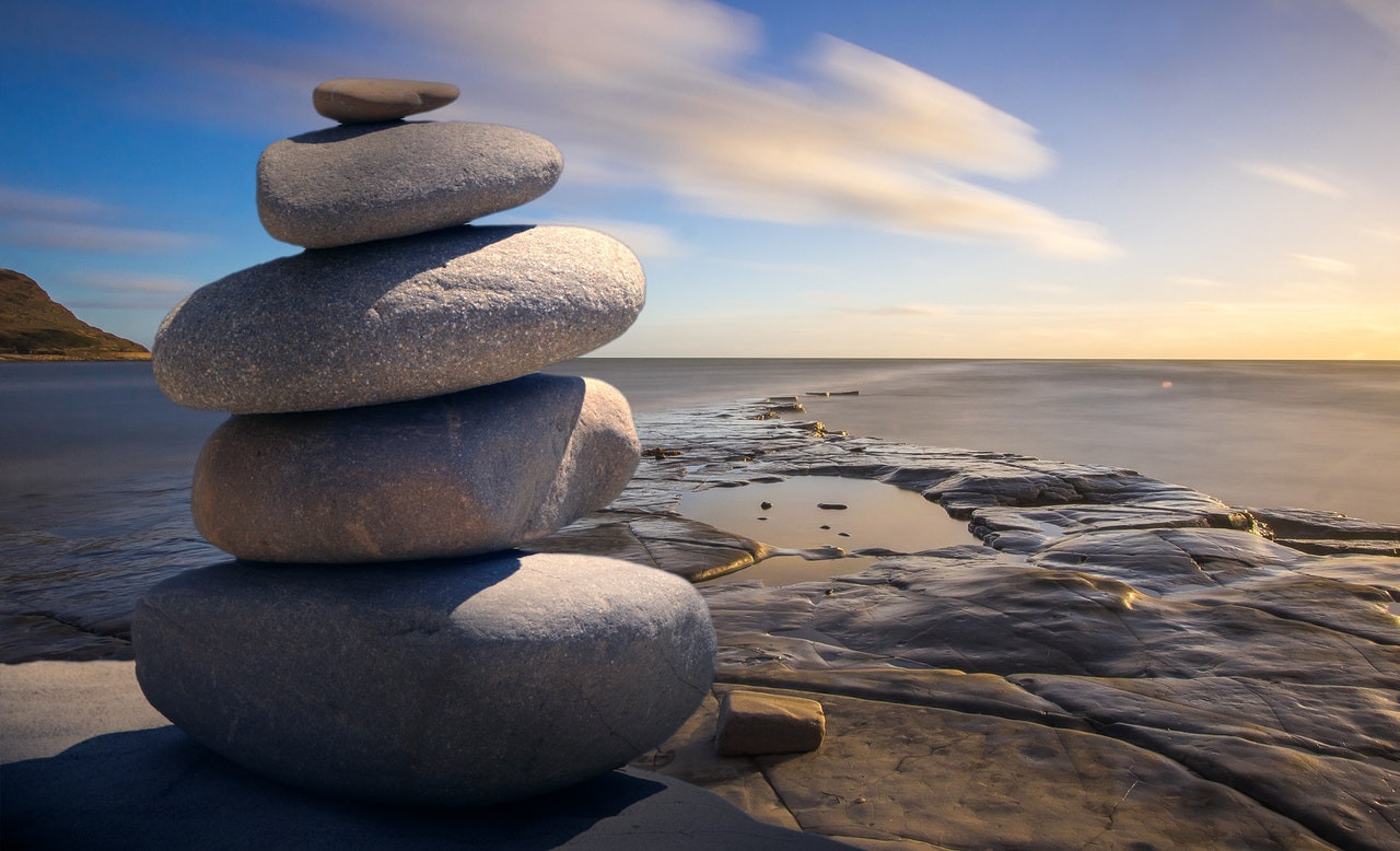 Stacked stones by water