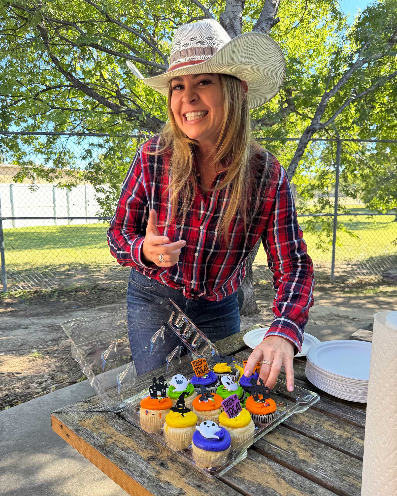 Katie Schorn, CEO, prepares treats for the THS Halloween party.