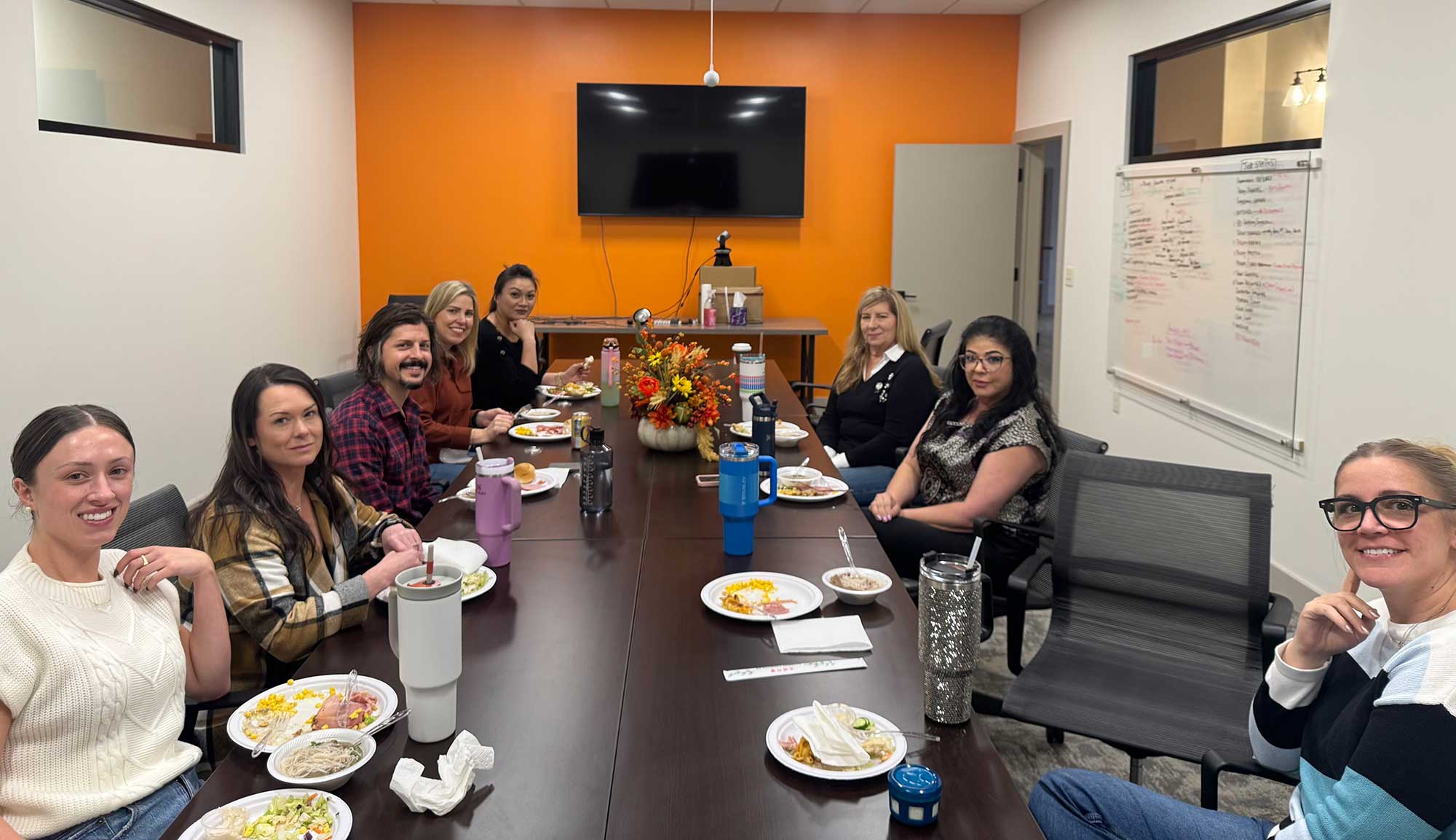 The THS team gathers to enjoy their Thanksgiving meal.