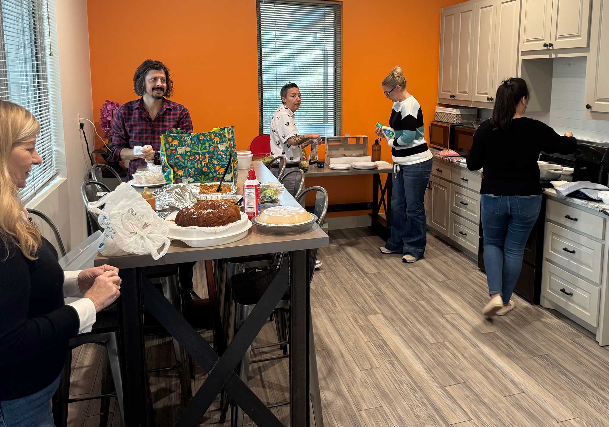 THS team members help themselves to a diverse buffet of homemade food at their annual Thanksgiving potluck lunch on November 24.