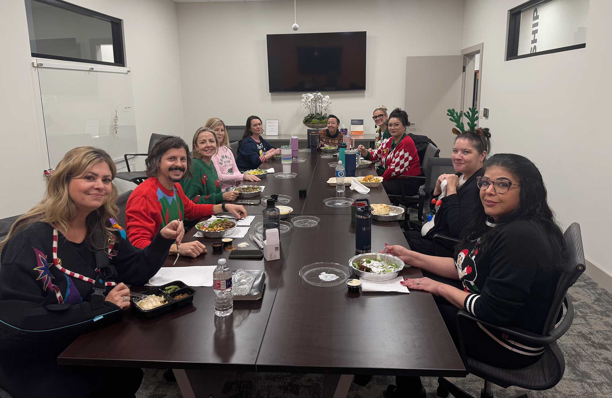 The THS staff enjoys lunch together on Ugly Christmas Sweater day.