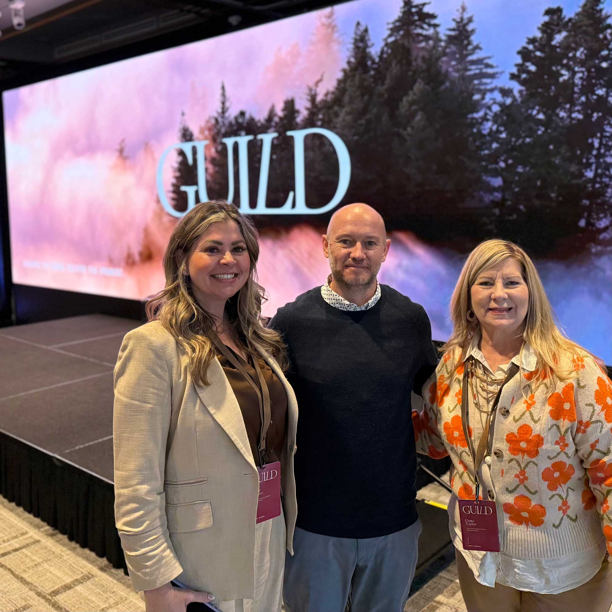 Katie Schorn, THS Founder & CEO, left, meets with Jason Delcamp, managing director and general manager of Makeready, a Dallas-based property management company, and Dana Foley-Taylor during the Makeready Guild 2026 conference last month at Denver’s Halcyon – a hotel in Cherry Creek.