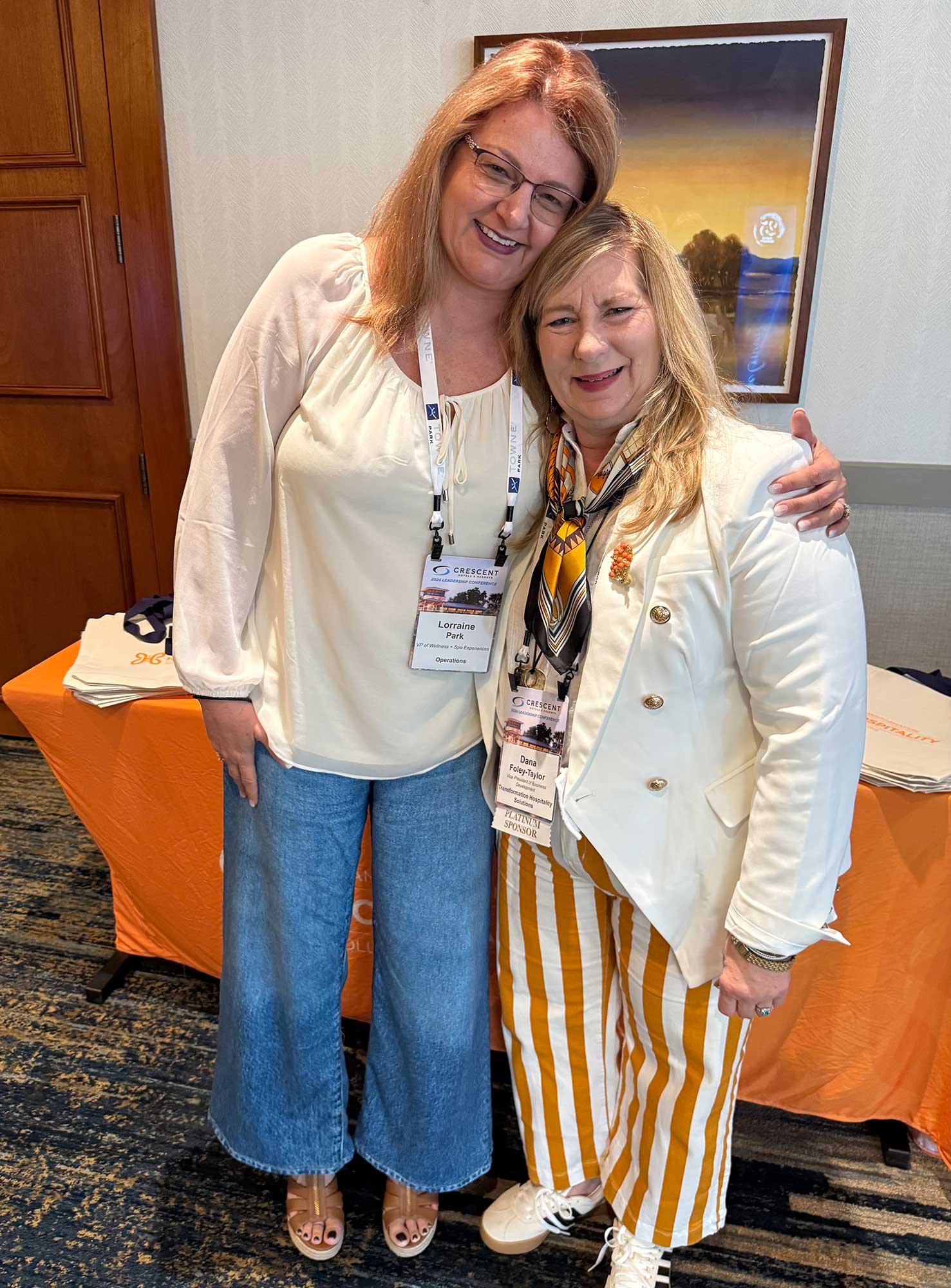 Dana Foley-Taylor connects with Lorraine Park, Crescent Hotels & Resorts vice president of wellness + spa experiences, during the company’s conference.