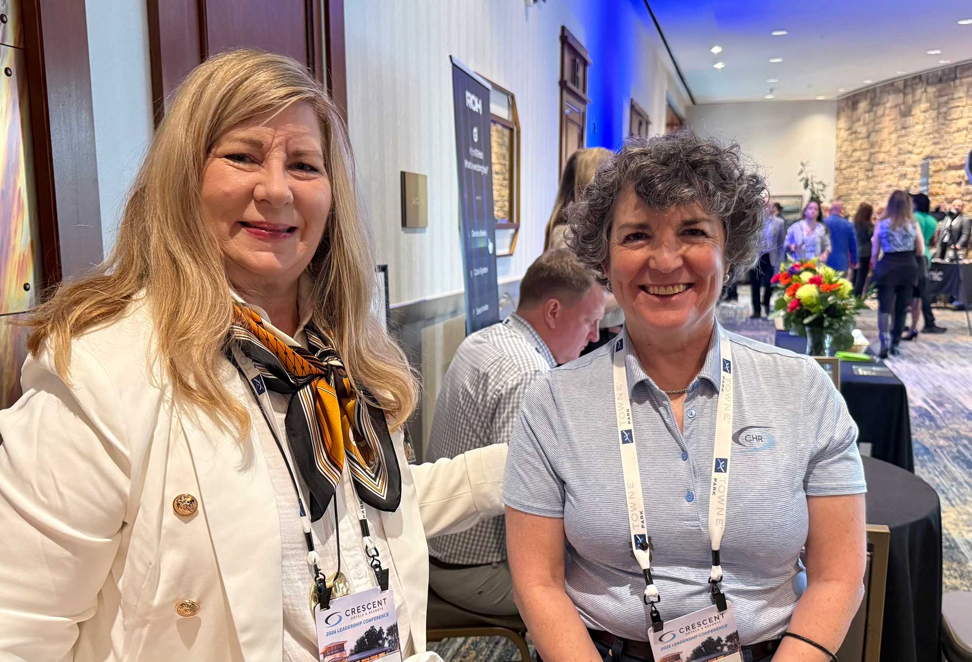 Dana Foley-Taylor speaks with Stephanie Johnson, Crescent Hotels & Resorts senior director of operations, during the conference.