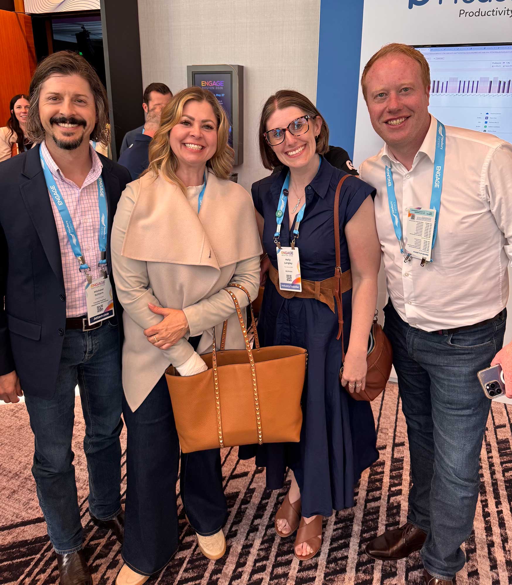 Michael Schorn and Katie Schorn meet with Holly Langley, ReSTACK founder and CEO, and Chris Little, ReSTACK sales and partnership director, during Bullhorn’s Engage Boston 2026 to discuss the software support they provide THS.