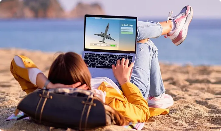 Black private jet aircraft on a flat surface with a cloudy sky background.