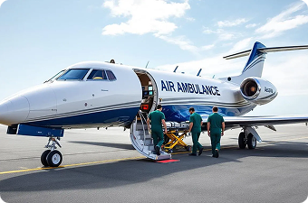 Medical team loading a patient on a stretcher into an Air Ambulance jet at an airport.
