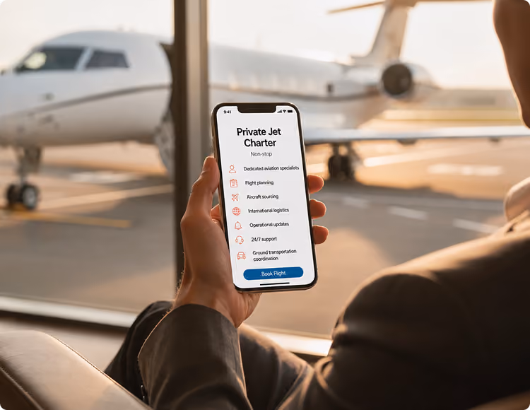 Person holding a phone displaying private jet charter booking app with a jet outside a window.