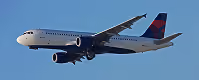 Delta Airlines commercial airplane flying in clear blue sky.