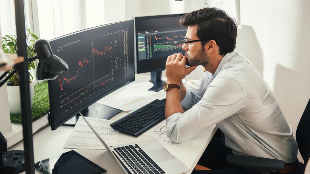 man watching a trading chart - Futures Trading Example	