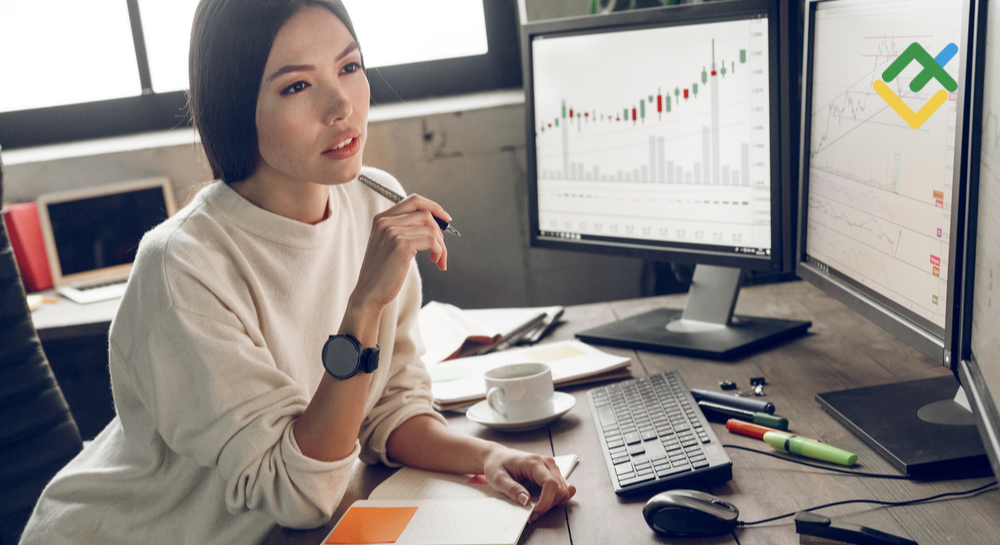 woman looking at a trading chart - Automated Futures Trading Strategies