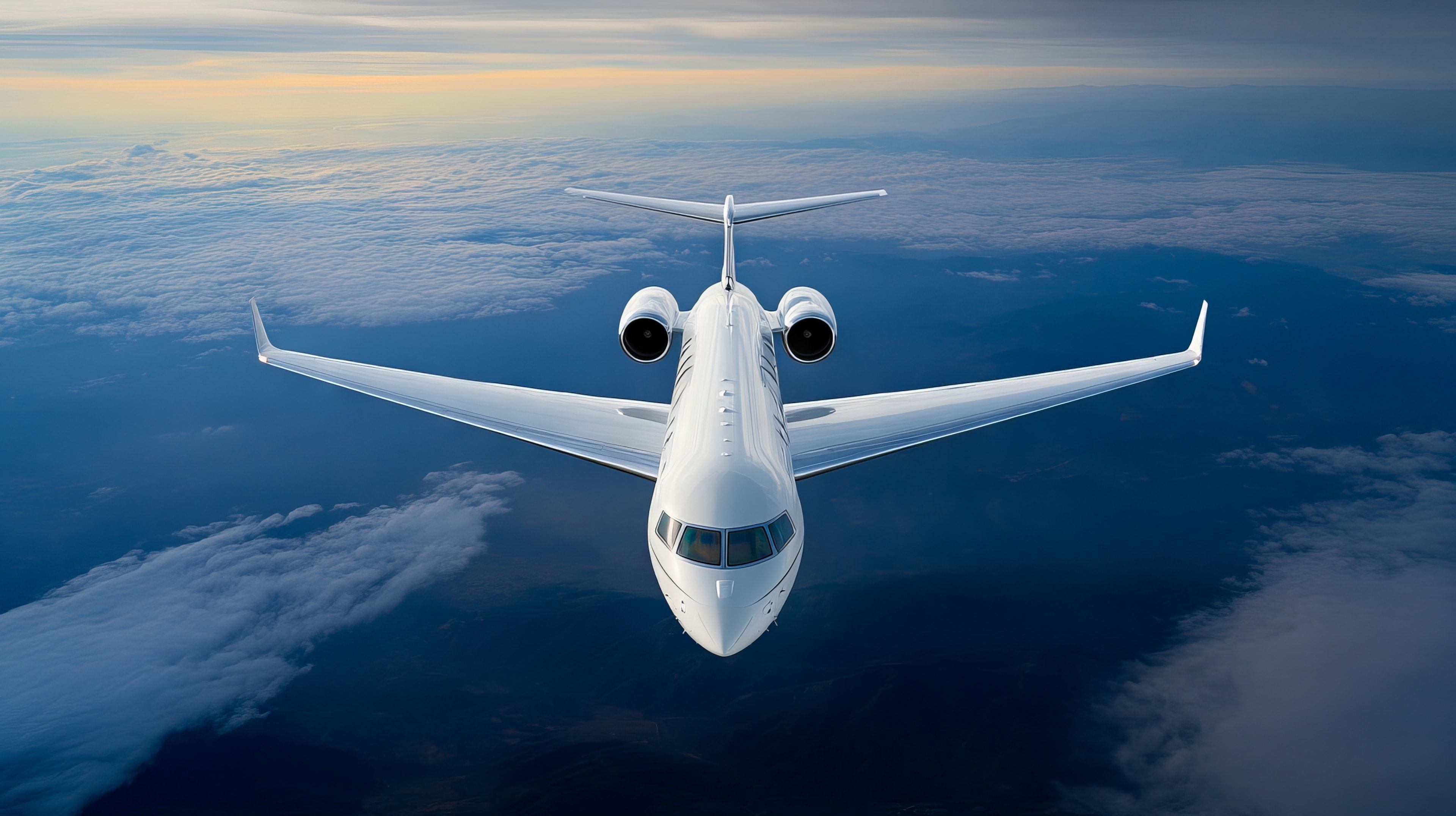 A private jet flying above the clouds in the sky
