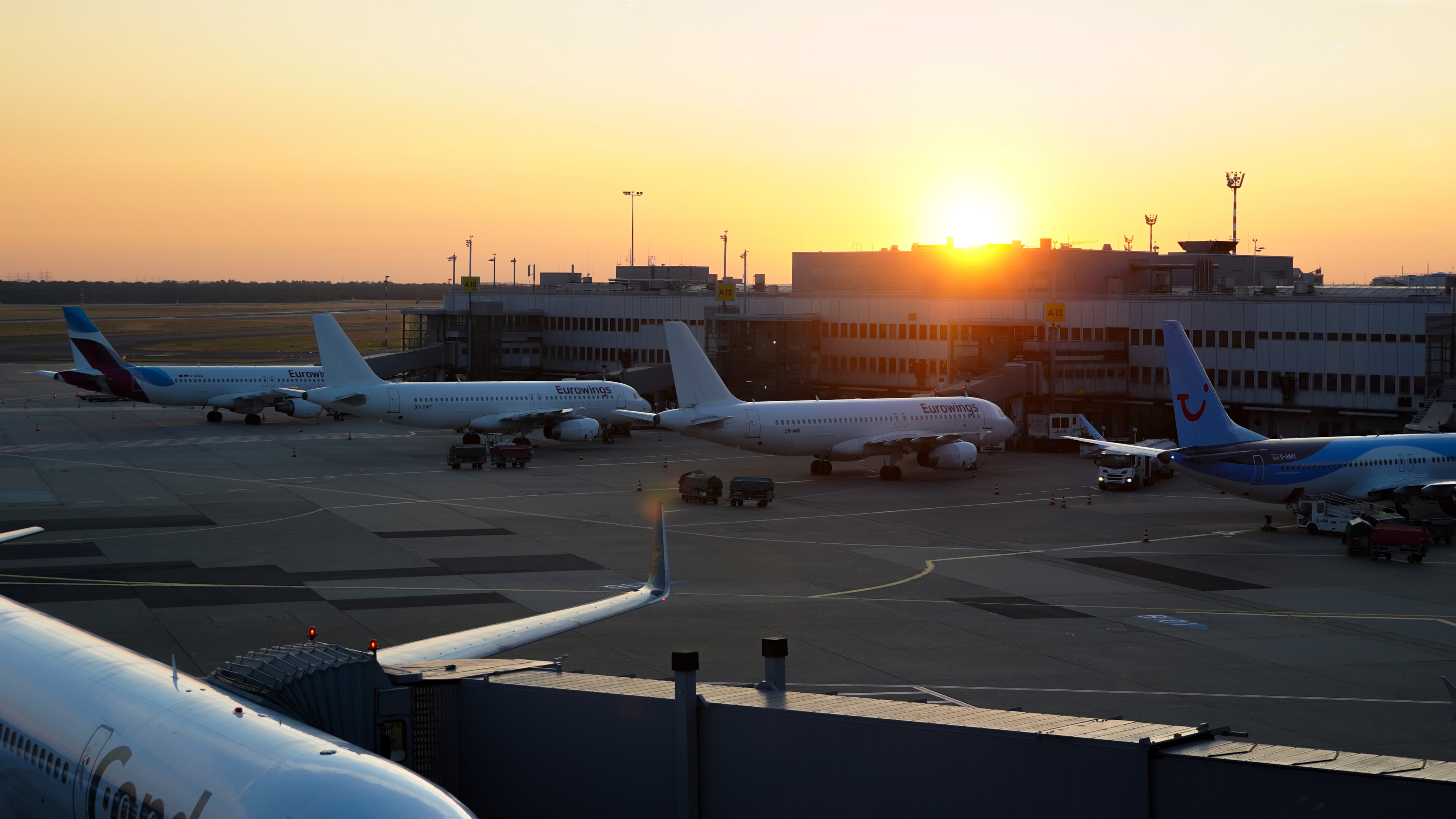 3 "Eurowings" Airbus A330 aircrafts at the gate of Terminal A at Duesseldorf Airport(DUS) at sunrise