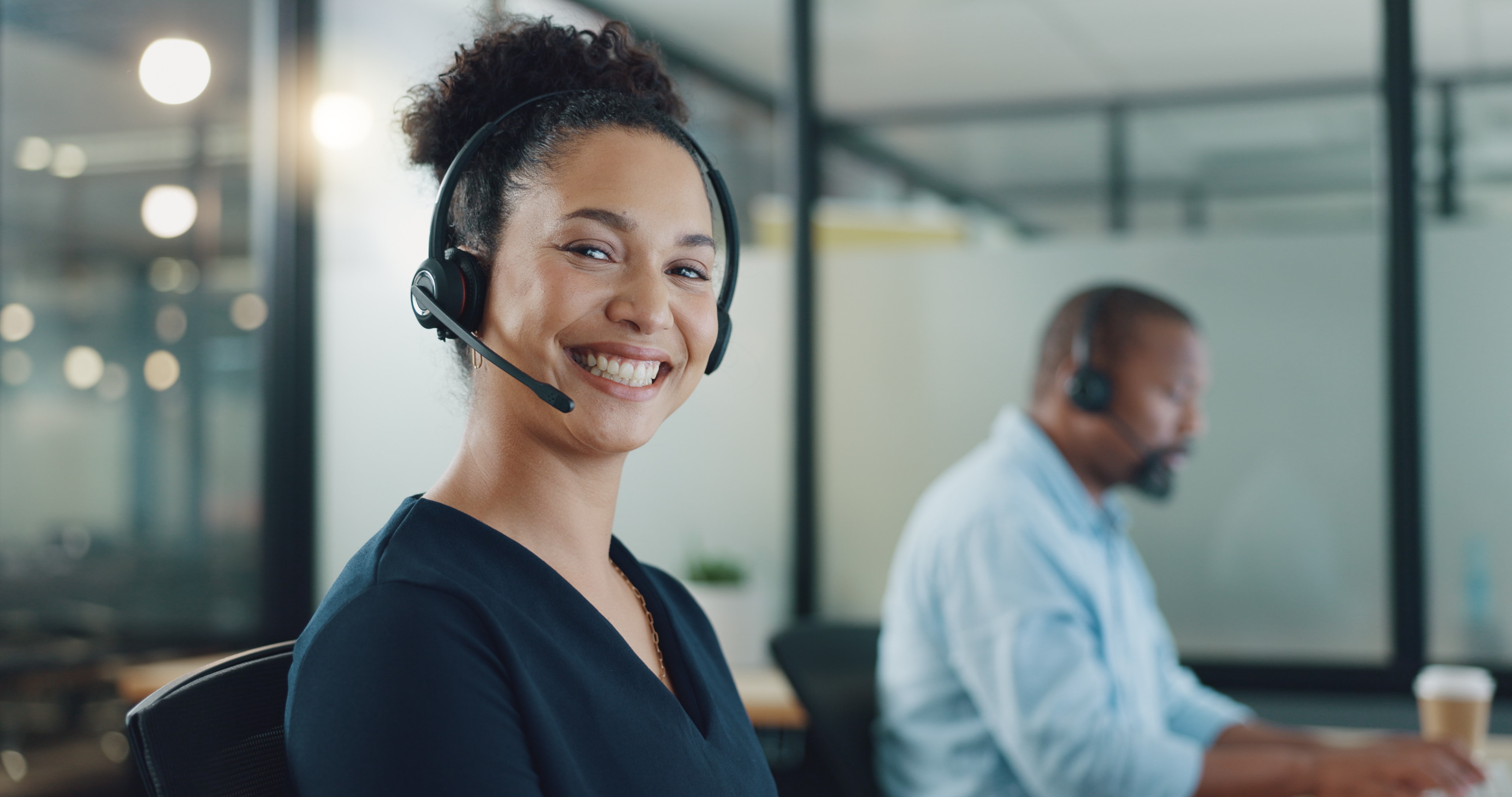 female agent smiling with headset