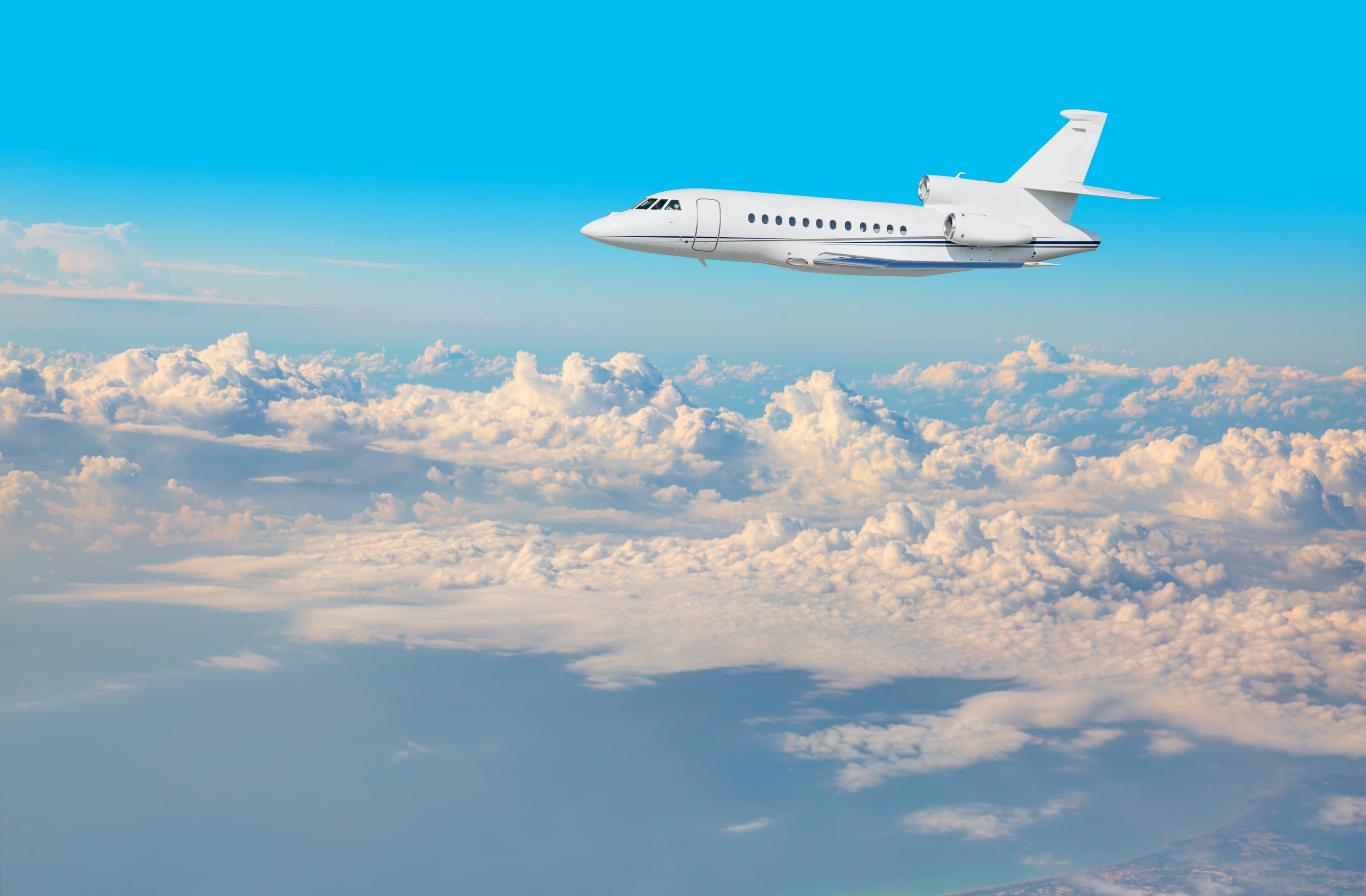 Luxury design private jet flying over the city