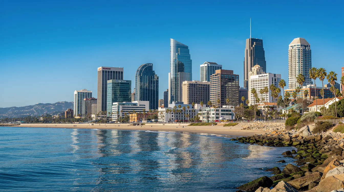 The image showcases the San Diego skyline against a backdrop of clear skies and coastal views, highlighting the vibrant cityscape of San Diego, CA. In the foreground, you can imagine the bustling activity around Montgomery Drive, where Crown Air's impressive FBO facilities provide exceptional customer service and safety for travelers.