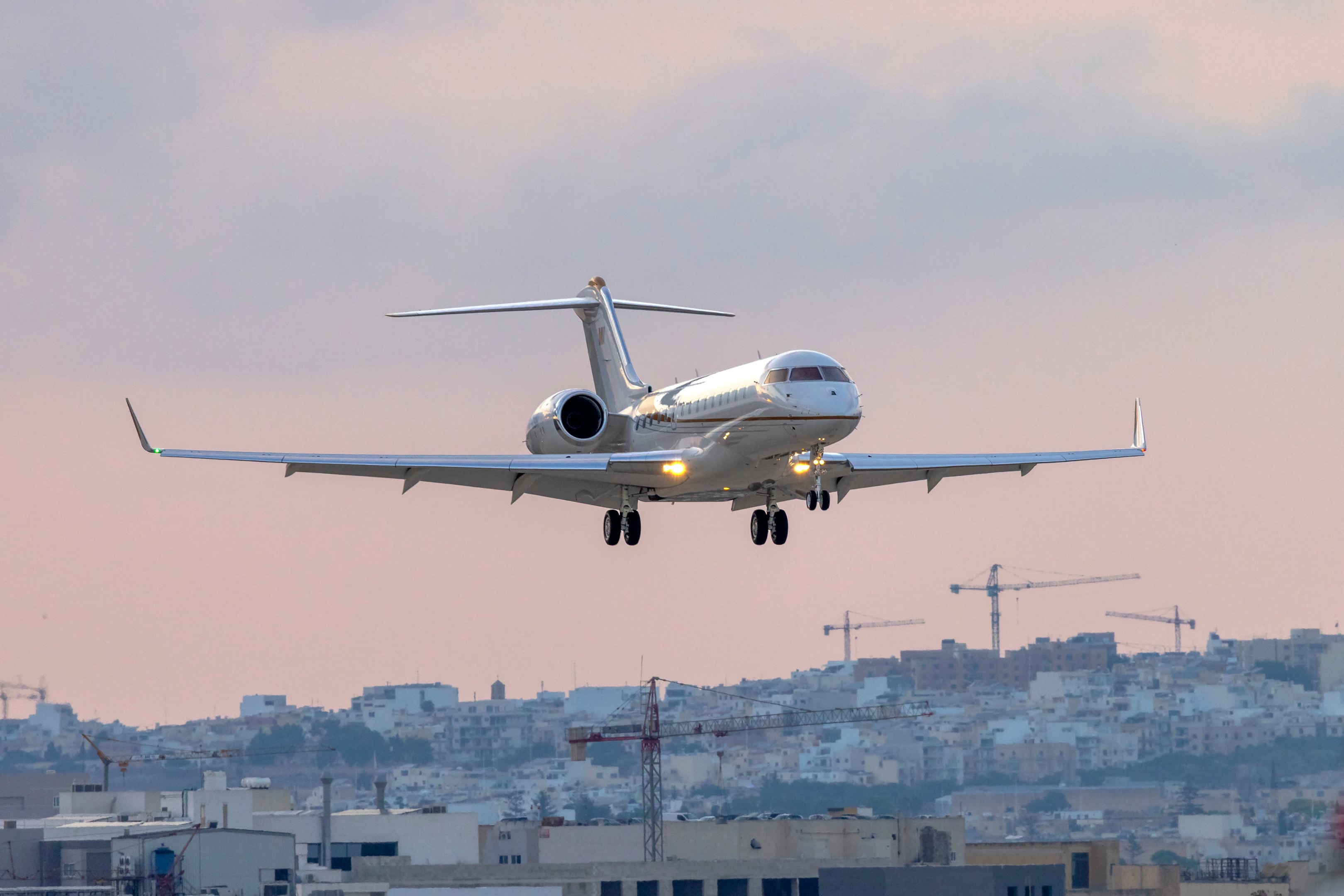 Private Australian registered Bombardier BD-700-1A10 Global 6500 (REG: VP-CSH) landing after sunset.