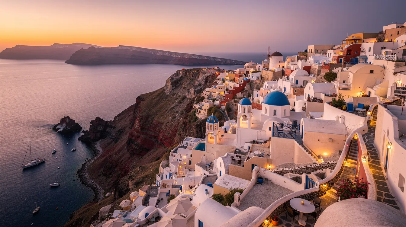 The image depicts a stunning cliffside village in Santorini at sunset, showcasing white buildings perched above a deep blue caldera, creating a picturesque scene. This enchanting destination is a popular choice for private jet travelers seeking to experience Greece's rich history and vibrant culture.