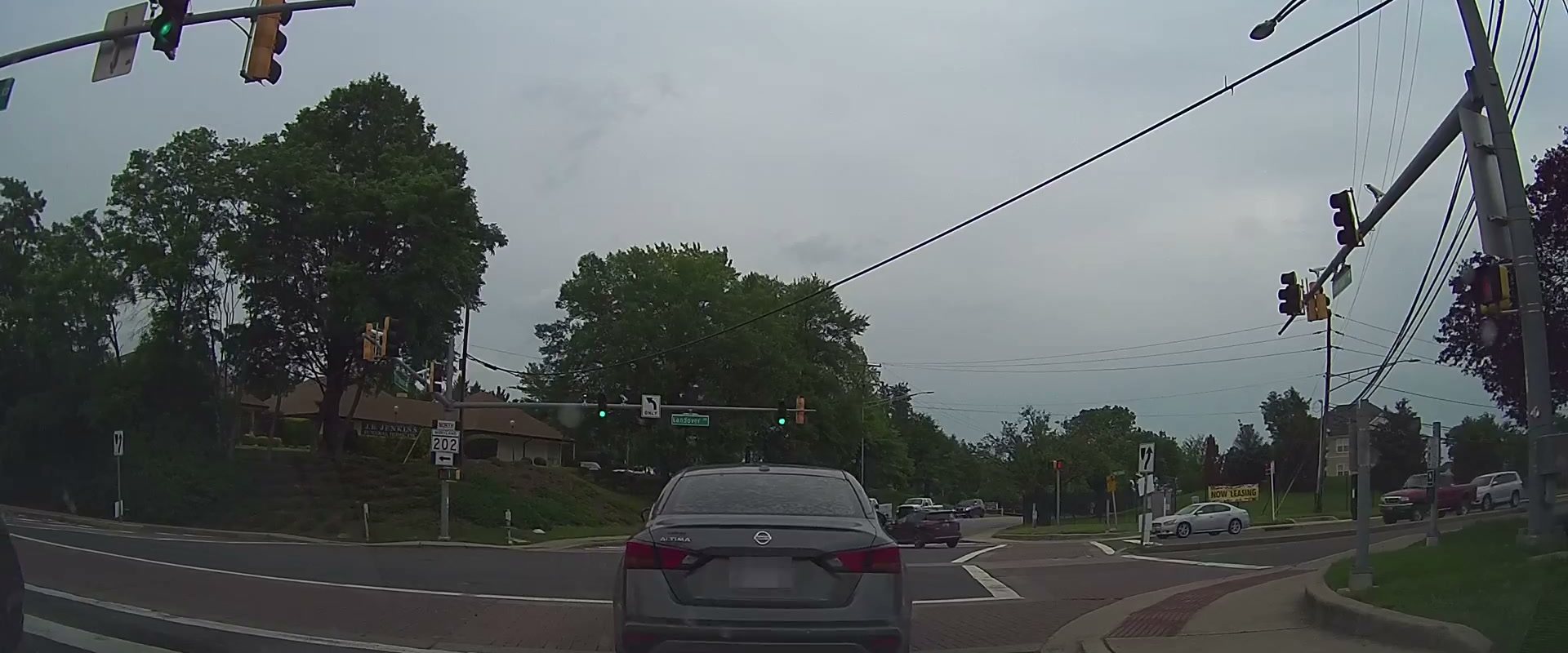 Dashcam view of a suburban signalised intersection