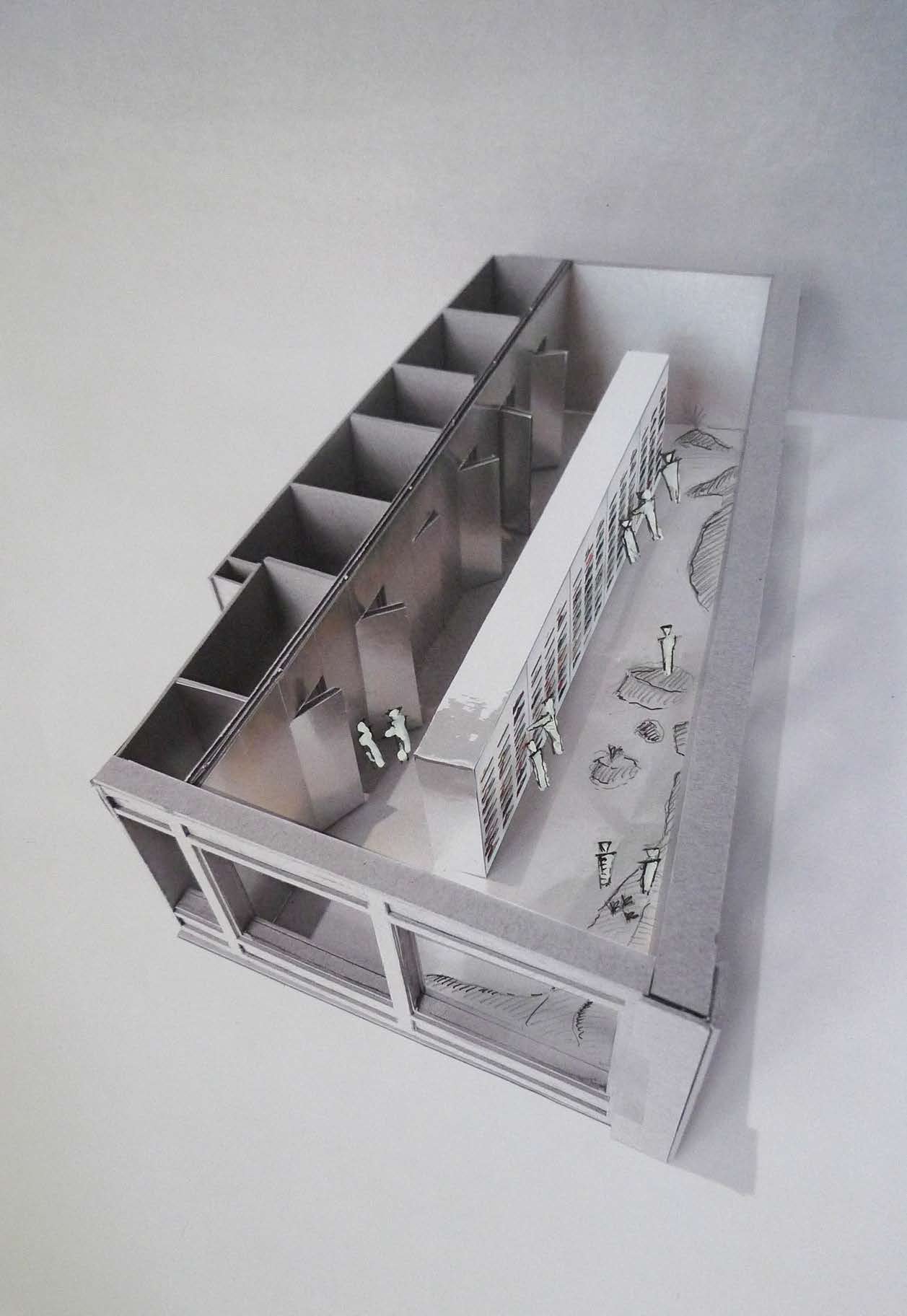 Architectural model of the On New York flagship showing the central display wall and customer circulation.