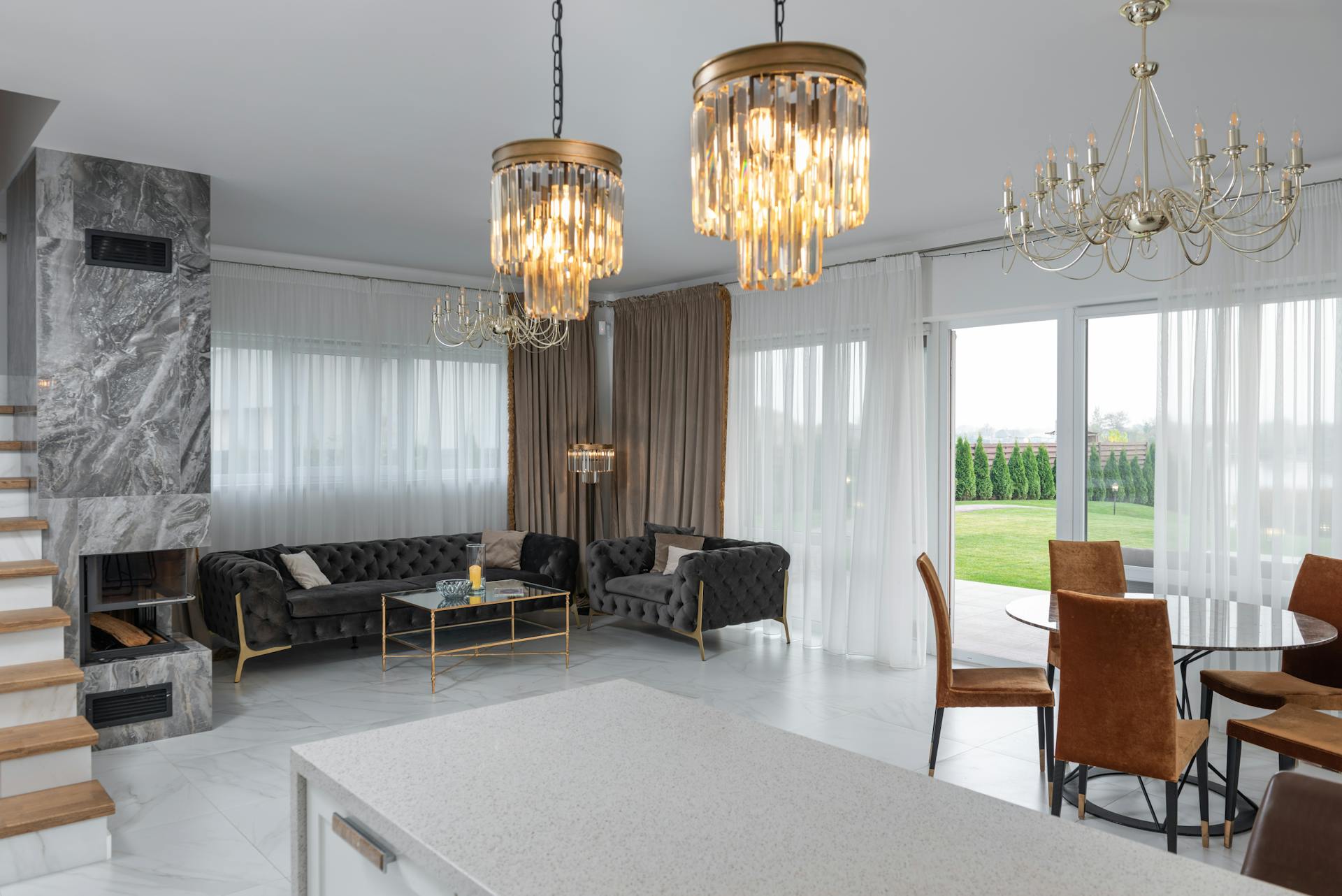 A living room filled with furniture and a chandelier.