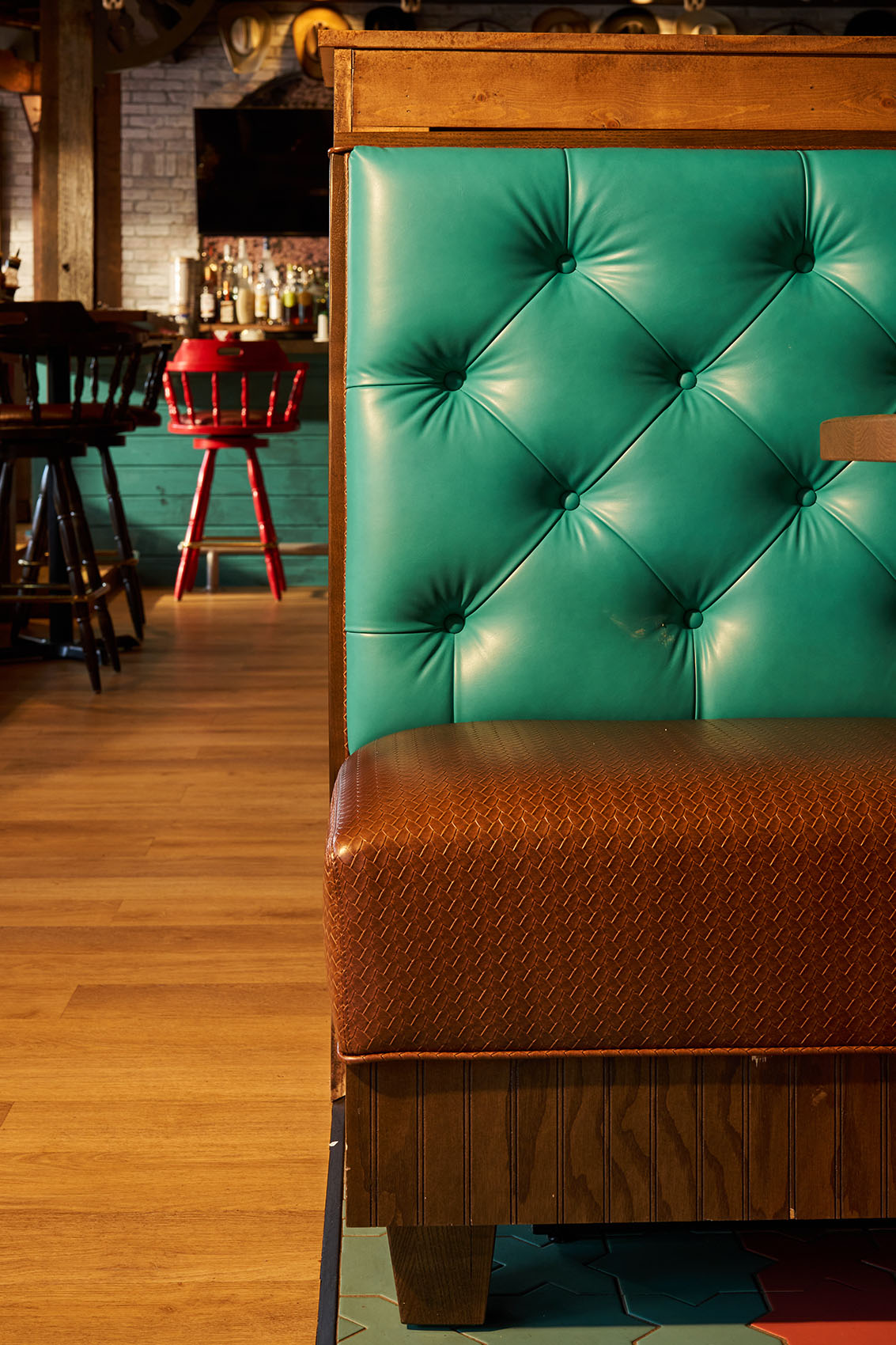 detail of booth with turquoise fabric and buttons