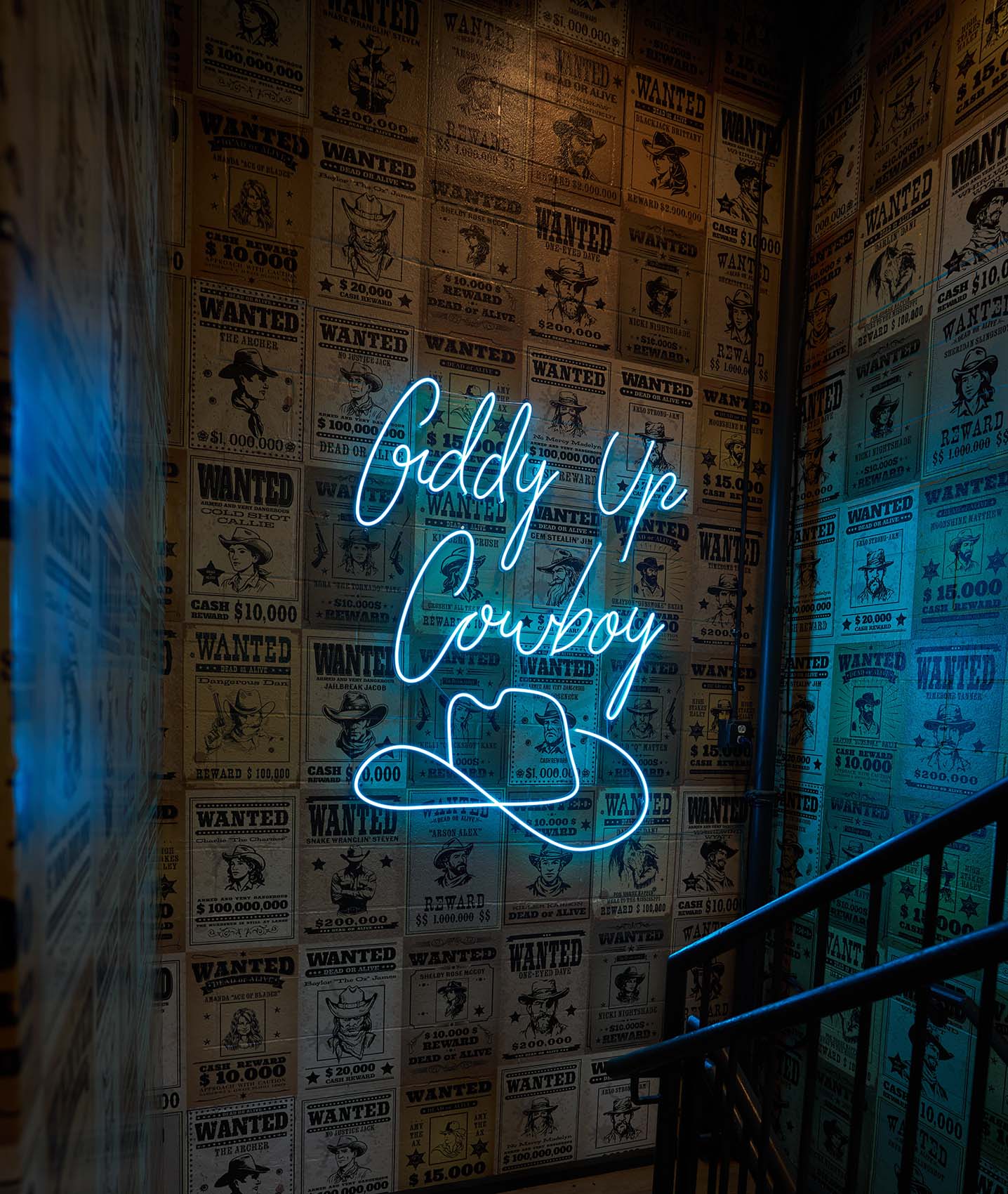 neon sign in stairwell with wallpaper