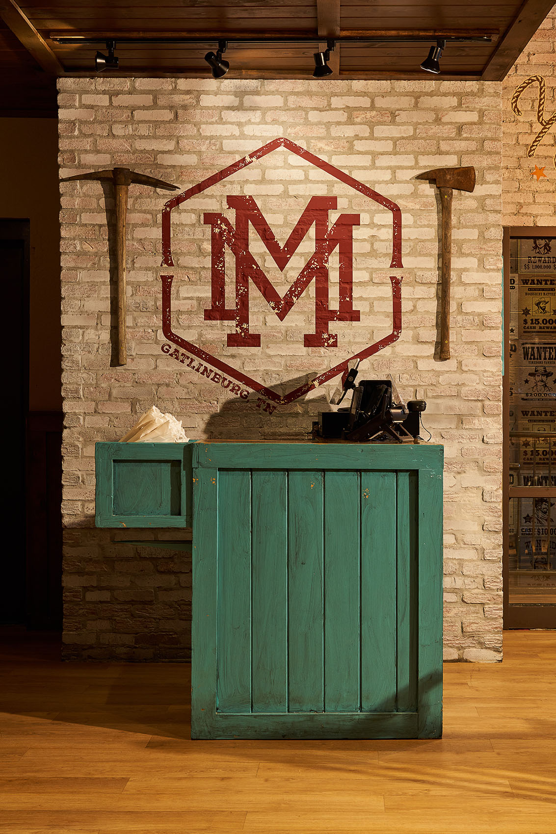 hostess booth for restaurant with logo behind

