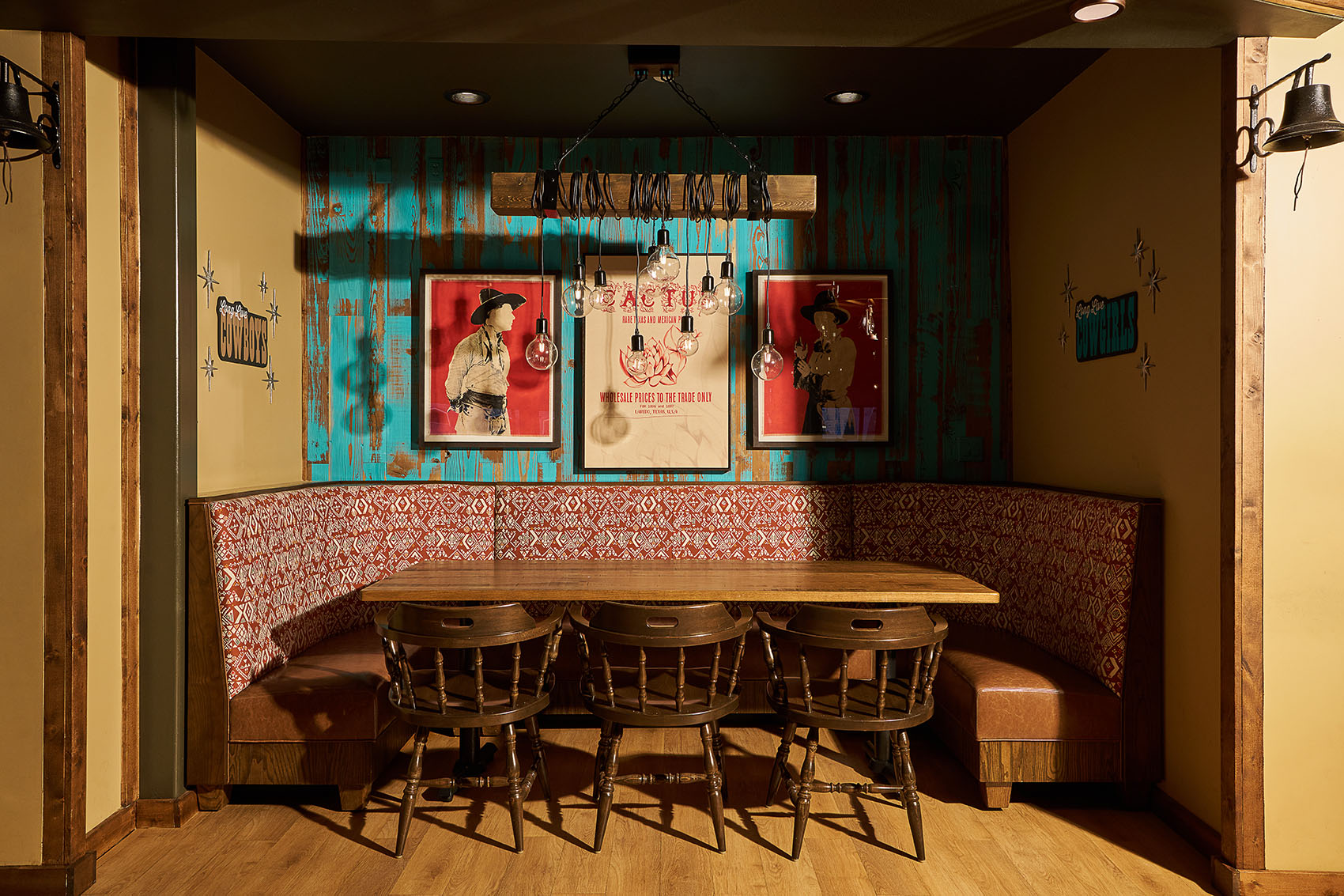 booth seating with wood chairs and artwork