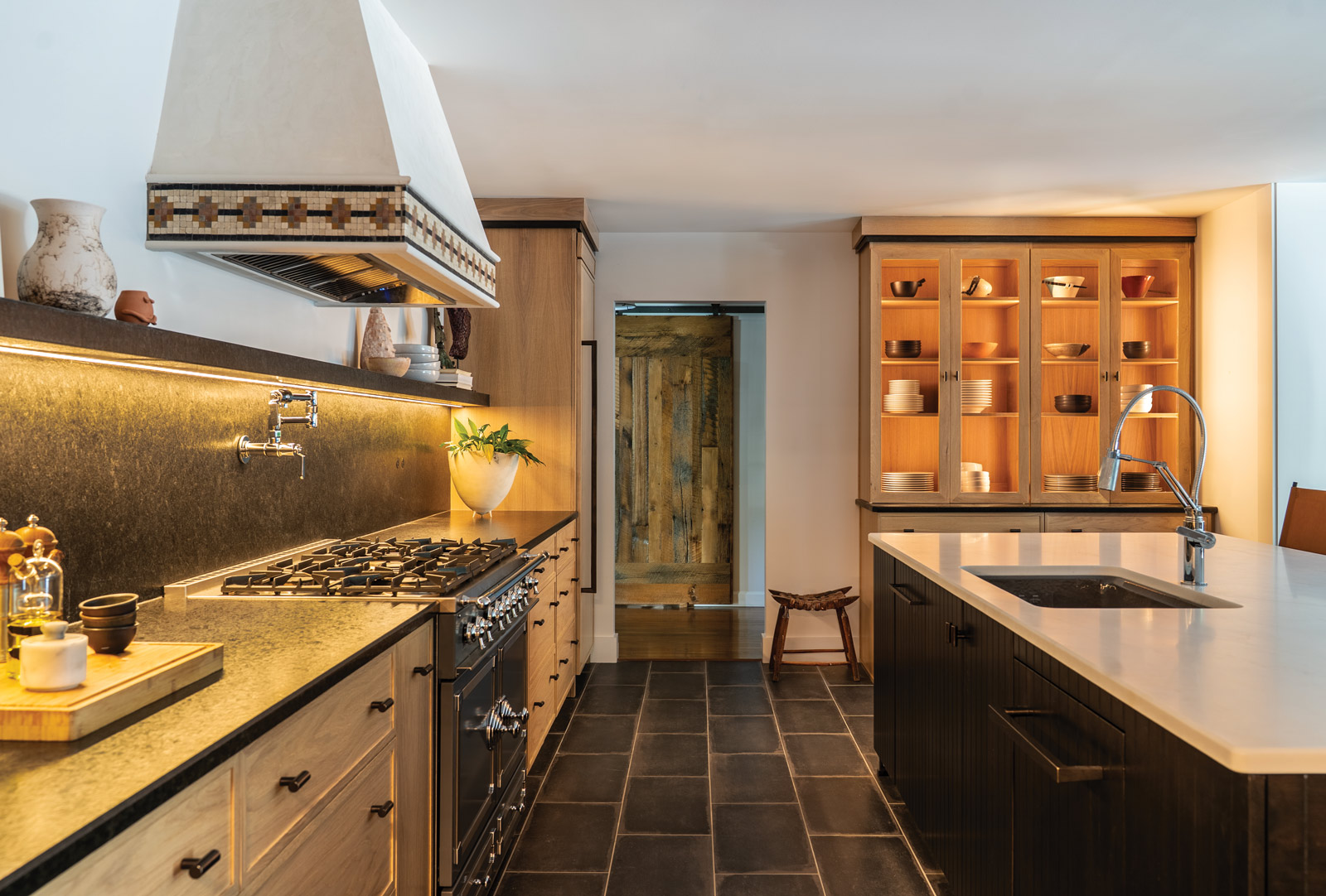 custom kitchen with decorative tile and custom fixtures