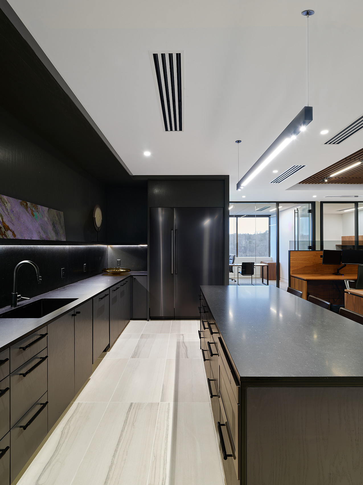 wide shot of kitchen area with custom black detailing